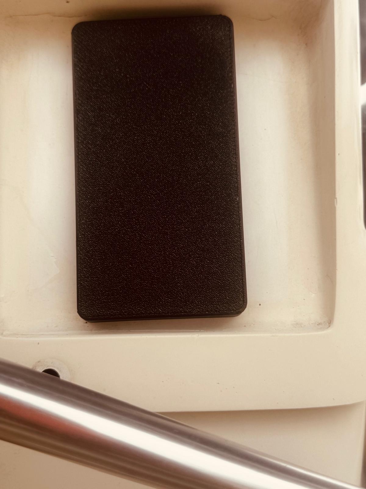 Autopilot controller with protective sun cover in boat