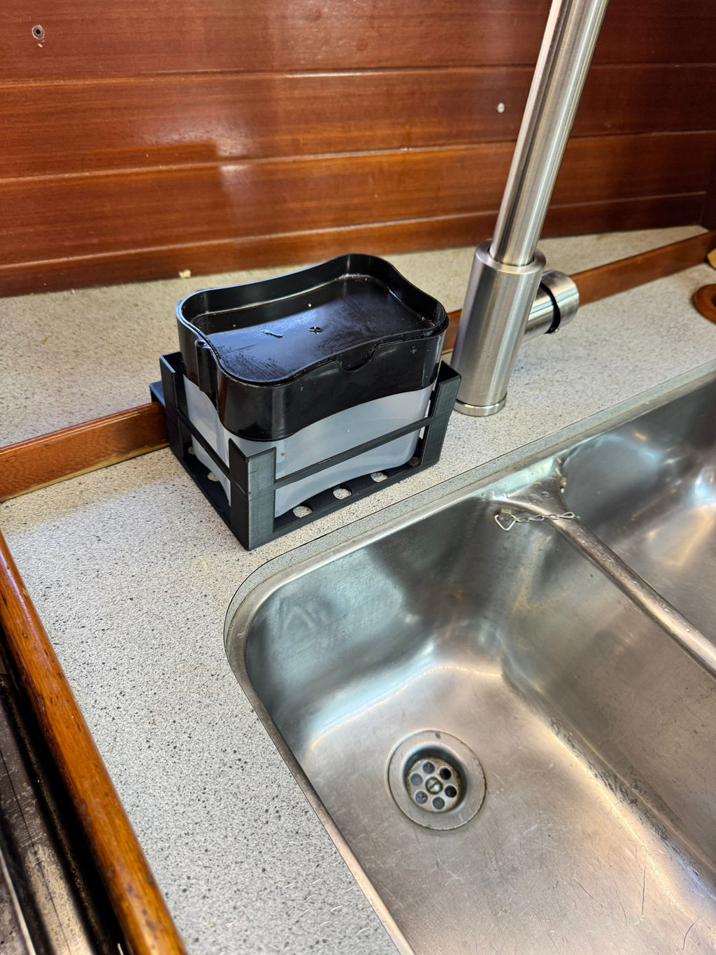 Soap dispenser holder installed in boat sink for stability during movement